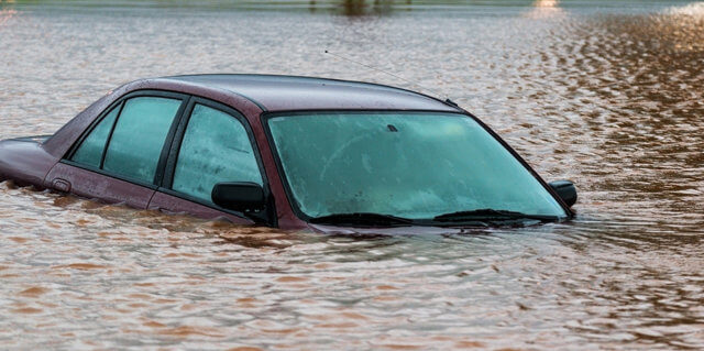 car under water after a dangerous flood